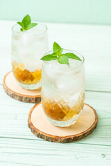 iced plum juice with soda and peppermint