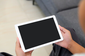 Hand holding blank screen phone or smartphone or tablet for template