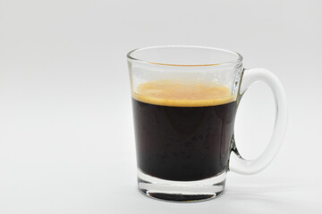 hot black coffee put on white table background