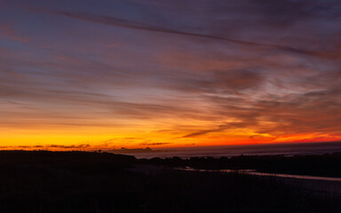 A beautiful sunset skies over the Pacific Ocean in California