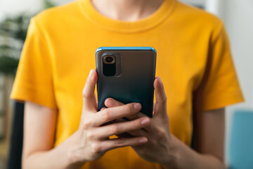 Hand holding smartphone with using social media on internet.