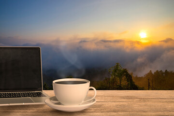 Morning coffee concept. Espresso coffee witn notepad on wooden table in  natural background in warm tone in morning autumn.