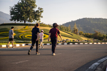 Fototapeta premium group of people exercise walking at public park healthy lifestyle concept.