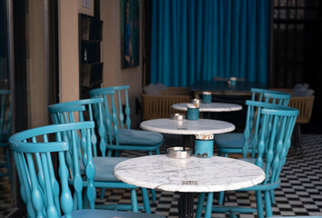 Empty cafe tables and chairs
.