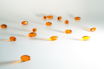 Soft gel, Close up of oil filled capsules, suitable for presenting food supplements : fish oil, omega 3, omega 6, omega 9, vitamin A, vitamin D, vitamin D3, vitamin E, evening primrose oil,