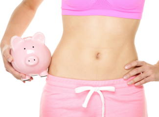 Healthy fitness lifestyle is expensive. Fit woman holding piggy bank - healthy and fitness costs money concept. Close up of female stomach isolated in transparent PNG.