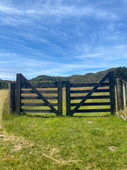 Fototapeta na wymiar A wooden gate on a farm in New Zealand