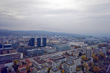 Fototapeta premium Aerial view of City of Zürich with skyline and panoramic view on a gray and cloudy late afternoon. Photo taken November 12th, 2022, Zurich, Switzerland.