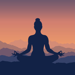 Silhouette of a woman in lotus pose meditating at sunrise	