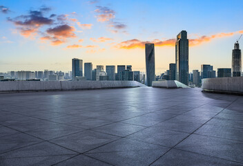 Obraz premium Empty square floor and modern city skyline with buildings at sunset in Ningbo, Zhejiang Province, China.