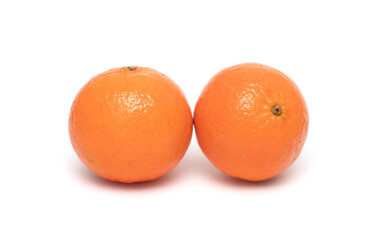 Ripe yellow tangerines on a white background.