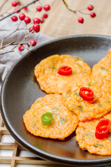 Kimchijeon, Korean Kimchi Pancake food : Slices of well-fermented kimchi mixed into a flour batter and pan- fried. Finely chopped pork, squid, and clam meat may be added to the batter as well.