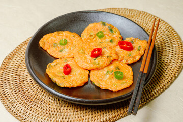 Kimchijeon, Korean Kimchi Pancake food : Slices of well-fermented kimchi mixed into a flour batter and pan- fried. Finely chopped pork, squid, and clam meat may be added to the batter as well.