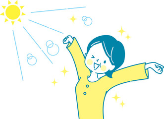 太陽の光を浴びながら伸びをするミドル女性