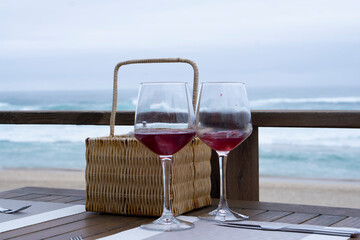 glasses of wine at the restaurant in front of the Atlantic ocean. Portugese restaurant