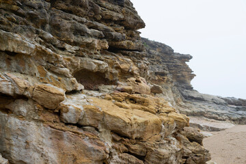 Rock formation isolated on white background. Rock formations in smmer, Nazare, Portugal. Rock background texture. 