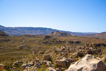 Beautiful rocky landscape in the Cederberg on a sunny day, blue sky, green shrubs, Western Cape, South Africa