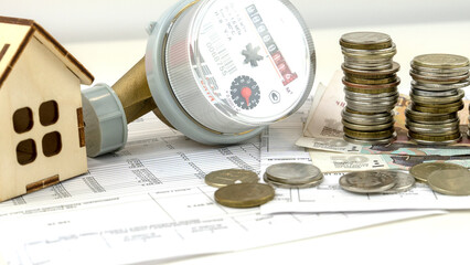 receipt for utilities. The hot water meter on the receipt with the money. the concept of utility...