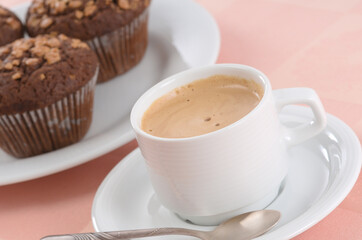 Cup of black coffee and chocolate chip muffins - 559360927