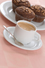 Cup of black coffee and chocolate chip muffins - 559360928