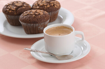 Cup of black coffee and chocolate chip muffins - 559360986