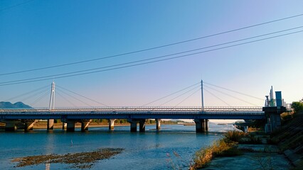 bridge over river with the blue sky