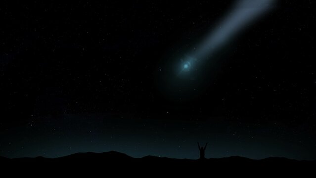  Silhouette of a person observing a comet in the blue starry sky at night. Comet Of The Year  devil comet, 12P/Pons-Brooks , C/2022 E3