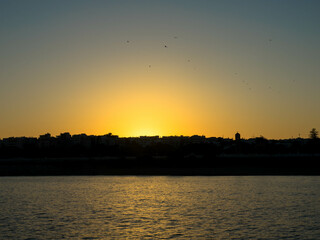 Panoramic view. Sunset over Rhodes town and port. Beautiful sky with space for text.