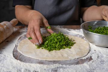 chef making dough with flour and herbs