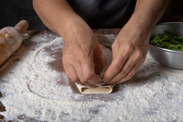 chef making dough with flour and herbs