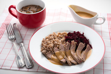 Boiled beef meat with buckwheat porridge, beetroot salad, and beef broth - 559371903