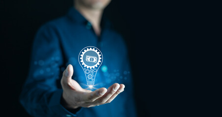 Businessman Holding visual light bulb for think idea for make money,The concept of how to make money idea