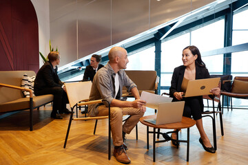 freelancer meeting businesswoman and talking about work or project in the office