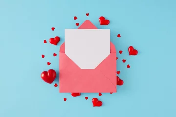 Fotobehang St Valentines Day concept. Flat lay composition made of paper envelope with letter and heart shaped red sprinkles on blue background. Minimal Valentines card idea. © Goncharuk film