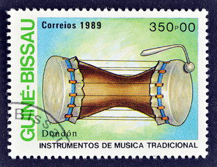 Cancelled postage stamp printed by Guinea Bissau, that shows Traditional Music Instruments -...