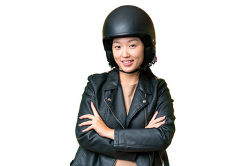 Young Asian woman with a motorcycle helmet over isolated chroma key background keeping the arms...