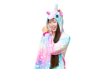 Young Asian woman with unicorn pajamas over isolated chroma key background celebrating a victory