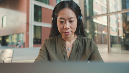 Young woman freelancer working on laptop
