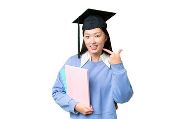 Young student woman over isolated chroma key background giving a thumbs up gesture