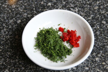 Parsley and red pepper for Salmon Lemon Cream Sauce