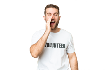 Young volunteer man over isolated chroma key background shouting with mouth wide open