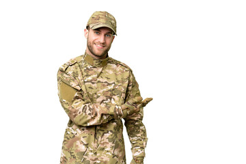 Military man over isolated chroma key background presenting an idea while looking smiling towards