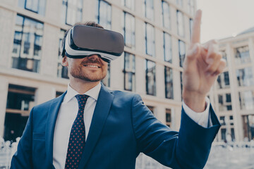 Businessman in formal blue suit using VR glasses outside