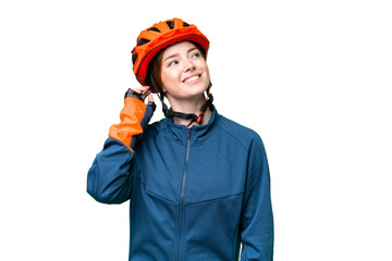 Young cyclist woman over isolated chroma key background thinking an idea