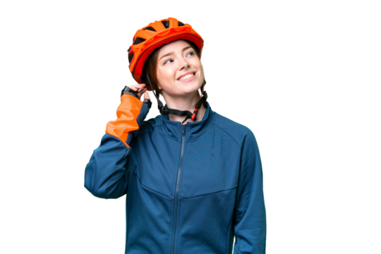 Young cyclist woman over isolated chroma key background thinking an idea