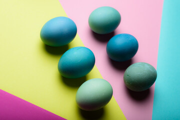 Happy Easter pastel coloured background. Hand painted Easter eggs abstract minimal concept.