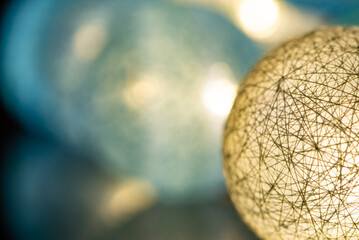 Christmas ornaments, beautiful illuminated Christmas ornaments in a low key composition, selective focus.