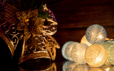Christmas ornaments, beautiful illuminated Christmas ornaments in a low key composition, selective focus.