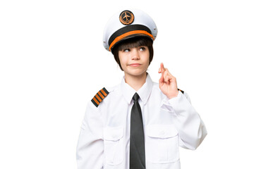 Little girl as a Airplane pilot over isolated chroma key background with fingers crossing and wishing the best