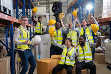 Diversity group of labor union in warehouse celebrate success after won protest salary increment